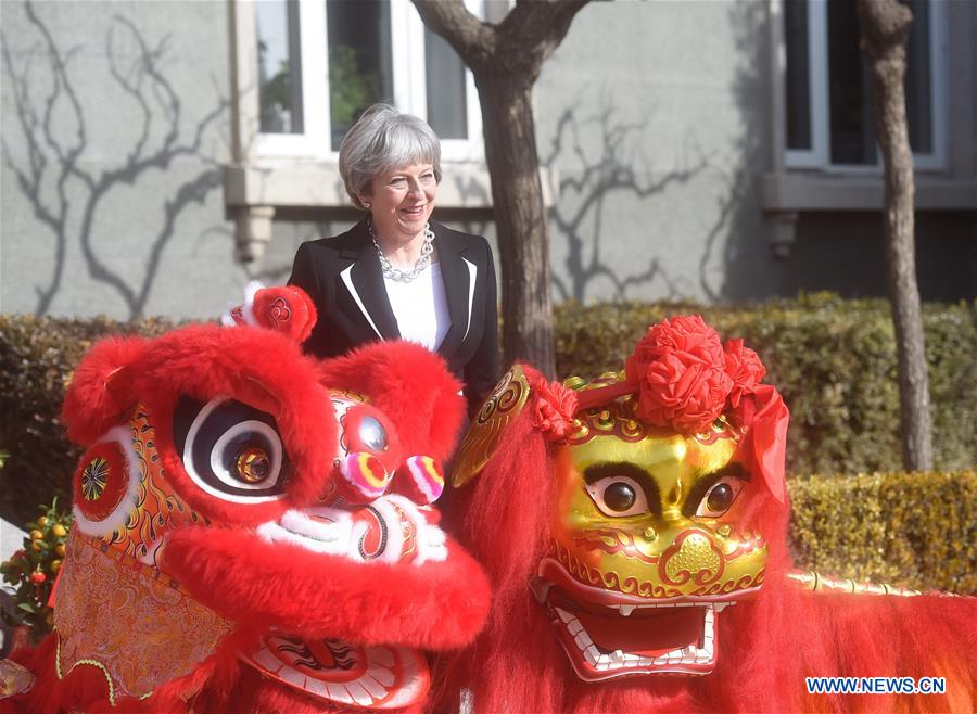 May Attends Cultural Reception in Beijing